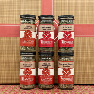 The Basic Spices - Pantry Pack 1 includes six essential dried herbs—chives, dill weed, cilantro, marjoram, French tarragon, and summer savory—making it a perfect kitchen pantry bundle. Displayed in two rows on a patterned background.