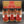 Three glass jars of ground spices from Tradition Spice Company, including Ceylon Cinnamon, Korintje Cinnamon, and Saigon Cinnamon, arranged in front of their branded cardboard gift box on a dark background.