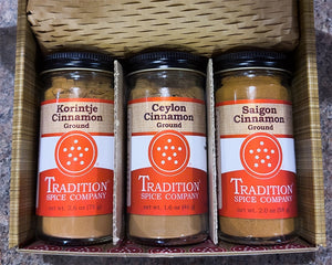 Three jars of cinnamon in a box
