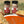 Two jars of garlic seasoning from Tradition Spice Company with bread and soup in the background.