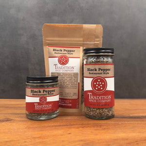 Three containers of Restaurant Style Black Pepper—one paper pouch, one small glass jar, and one tall glass jar—are displayed on wood with a gray background, highlighting bold seasoning perfect for any kitchen.