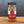 A glass jar of Turkish Spice, Worldly Wow! Bold Türkiye Blend by Tradition Spice Company sits on a wooden surface with a gray background. The label reads Turkish Spice, Worldly Wow! Bold Türkiye Blend and contains 2 oz (56 g).