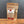 A stand-up pouch of Tradition Spice Company Turkish Spice on a wooden surface against a dark gray background.