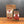A jar and stand-up pouch of Tradition Spice Company Best Bruschetta Italian Appetizer Mix displayed on a wooden surface against a dark gray background.