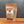 A stand-up kraft paper pouch of Tradition Spice Company 'Taste of Tuscany' bread dry mix, standing on a wooden surface against a dark gray background.