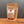 A stand-up pouch of Tradition Spice Company 'Slice of Sicily' bread dip mix, shown on a wooden surface against a dark gray background.