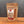 A stand-up pouch of Tradition Spice Company Kansas City BBQ Dry Rub seasoning, displayed on a wooden surface against a dark gray background.