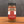 A glass jar of Tradition Spice Company Colorado Cowboy BBQ Dry Rub Seasoning sits on a wooden surface against a dark gray textured background.