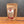 A stand-up pouch of Tradition Spice Company Colorado Cowboy BBQ Dry Rub seasoning, displayed on a wooden surface against a dark gray background.