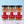 Three glass jars of Tradition Spice Company bread dips lined up on a white marble surface against a light blue background. The jars contain Italian appetizer mix, bread dip mix, and sliced of icily bread dip mix, with black lids and red and white labels.