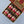 Six glass jars of Tradition Spice Company ground spices arranged in two rows of three in a Tradition gift box. The jars include Allspice, Cinnamon, Ginger, Cardamom, Cloves, and Nutmeg, each with a black lid and a red-and-beige label.