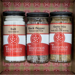 The Welcome Home Gift Box includes three essentials from Tradition Spice Company—Granulated Salt, Restaurant Style Black Pepper, and Da Best Garlic Mix—making it a perfect housewarming gift.