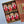 A gift box of six spice jars from Tradition Spice Company, arranged in a brown kraft box with shredded paper filler. The open lid on the right shows a patterned interior and a label that reads 'amazing' with 'now 90 season spices.