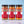 Three glass jars of Tradition Spice Company dry rub seasonings lined up on a light marble surface against a soft blue background. The products are Honey Aleppo Pepper, Honey Habanero, and Honey Garlic Sriracha, each showing a colorful spice blend inside.