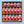 A gift box of 20 jars of Tradition Spice Company hot and spicy blends, arranged in a wooden tray with crinkle paper packing material, set against a light blue background.