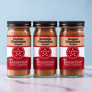 Three Tradition Spice Company jars of Ceylon, Korintje, and Saigon ground cinnamon.