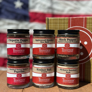 Jars of Tradition Spice Company spices with an American flag in the background