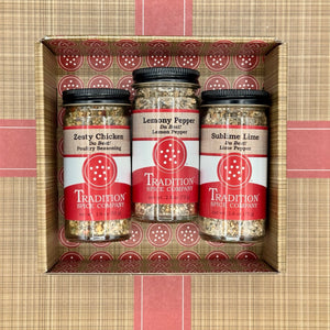The American Kitchen Mega Pack features three chicken seasonings—Zesty Chicken, Lemony Pepper, and Sublime Lime—in a plaid box with red accents, perfect for spicing up any weeknight dinner.